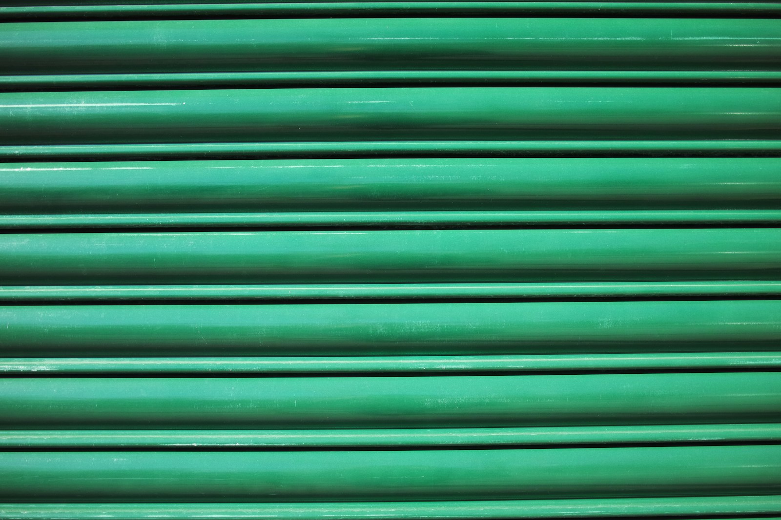 green and black striped textile